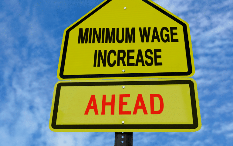 Road sign that says 'Minimum wage increase AHEAD'